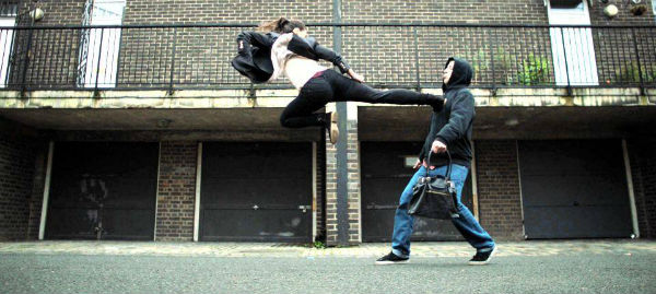 Zara Phythian fly-kicks an opponent in the short film, Kung Fu Darling (2016).