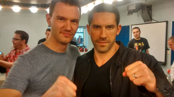 Kung Fu Movie Guide podcast host Ben Johnson with Scott Adkins at the 2014 Fighters Inc. SENI expo in London, UK.